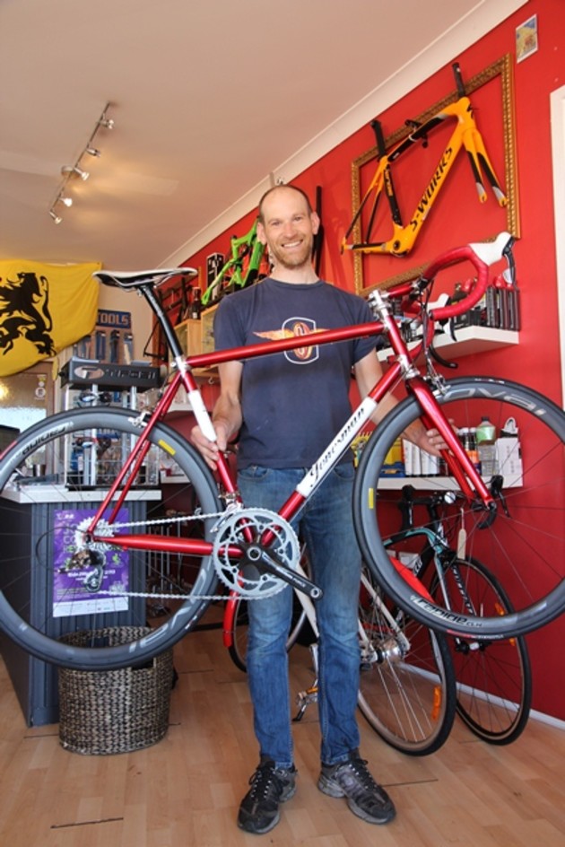Chris Jones proudly displays one of his Jonesman bikes.